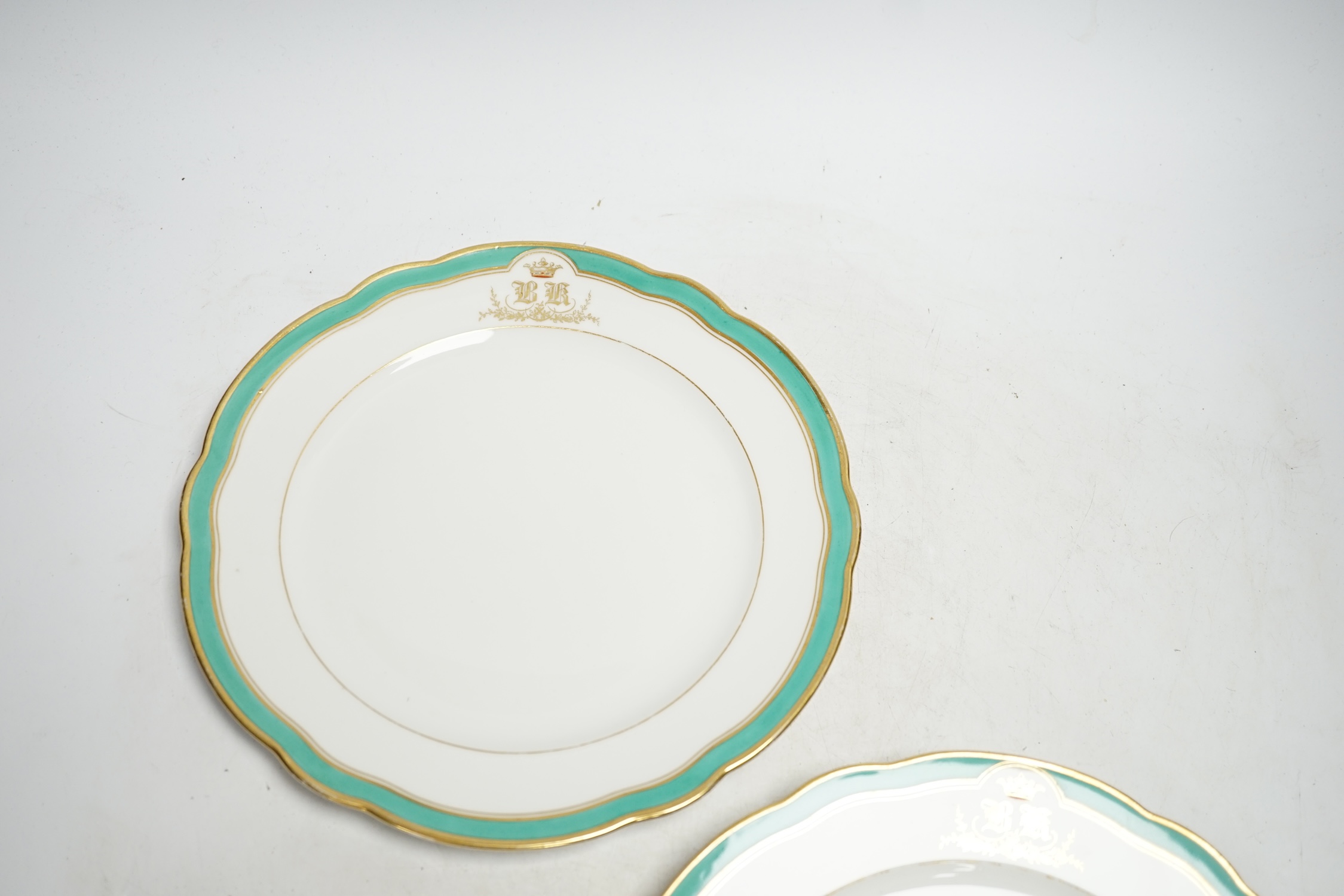 A pair of Russian Imperial Porcelain Factory plates with Alexander cipher to the reverse and crowned gilt monogram ‘BK’ to edge, 25cm diameter